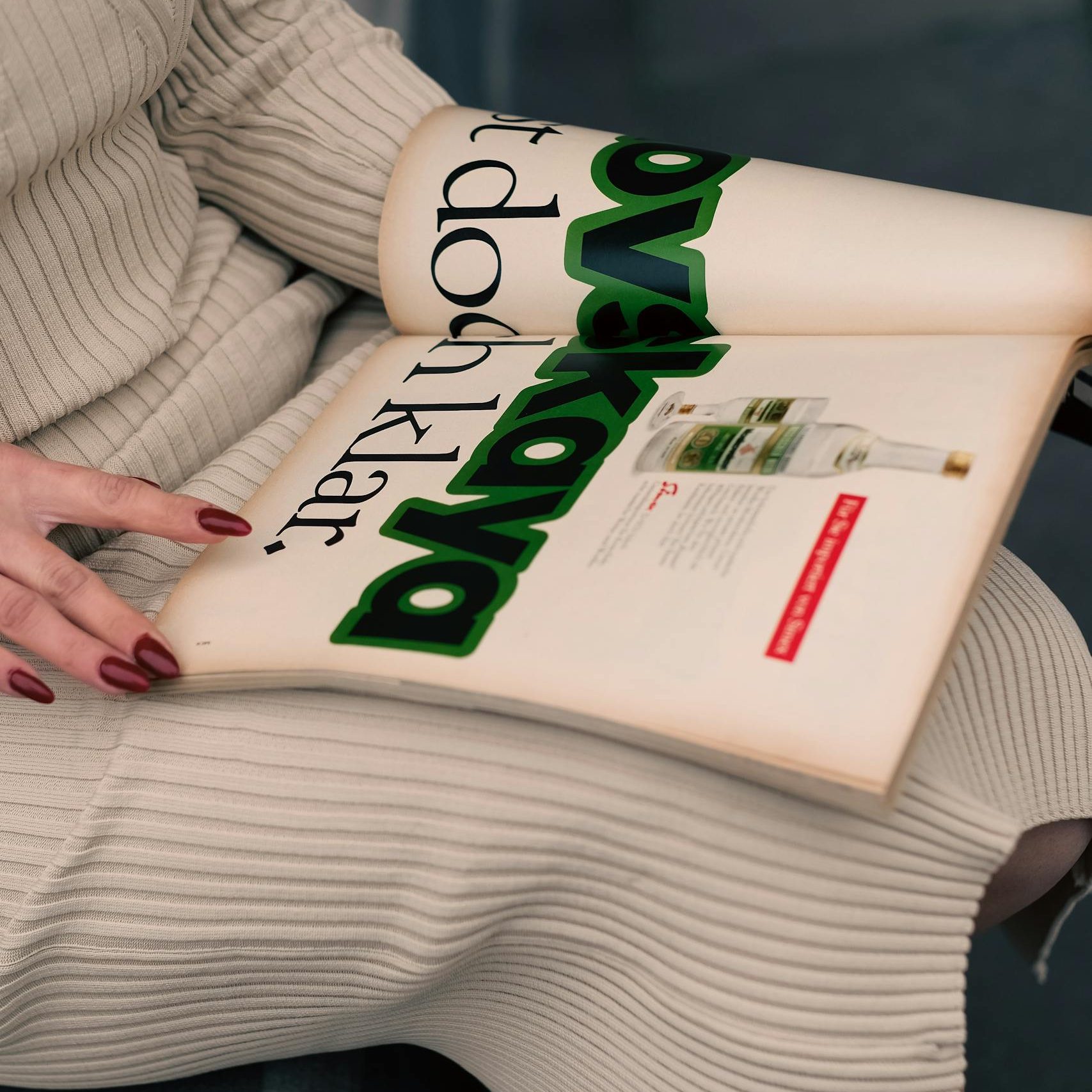 Woman Sitting with Magazine